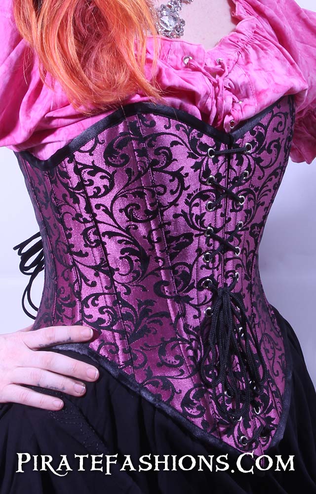 https://piratefashions.com/cdn/shop/products/pink-princess-corset2_1200x.jpg?v=1666973260